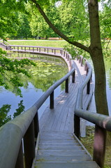 Wooden bridge over the pond in Vorontsov Park, Moscow, Russia
