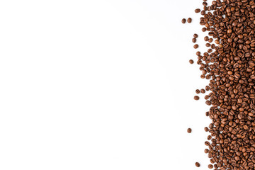 Roasted coffee beans isolated on white background. Close up