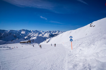 bavarian alps mountain top in winter ski run