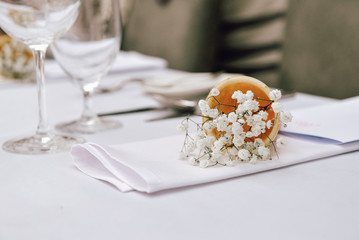 Delicate white Gypsophila flowers in ice cream cone. The wedding decor. Table set for an event party or wedding reception. Beautiful flowers on table.