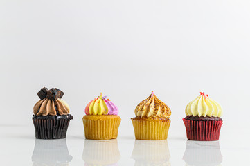 Variety Cupcakes with candle Birthday party on white background, Anniversary concept 