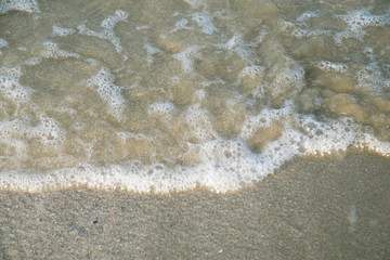 Wave of water splash on the sea beach