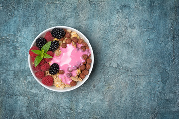 Healthy breakfast - oatmeal with fresh berries and homemade yogurt
