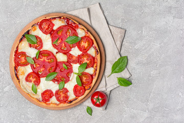 Pizza margarita with tomato, mozzarella cheese and basil