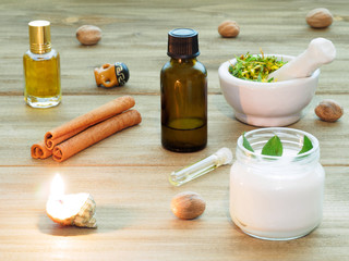 Natural aromatherapy and spa ingredients on a brown wooden background
