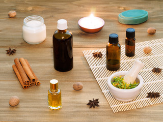 Natural aromatherapy and spa ingredients on a brown wooden background