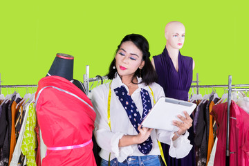 Female designer using a digital tablet in the studio