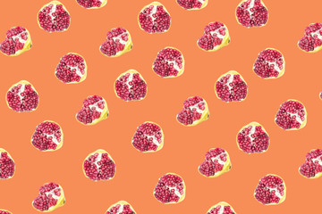 Fruit pattern of Pomegranates on Orange background. 
