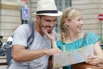 man and woman with a map