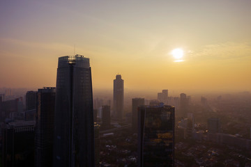 Fototapeta na wymiar Silhouette of skyscrapers and dense residential