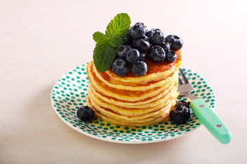 Pancakes with blueberry on top, served