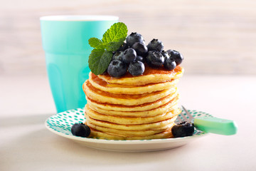 Pancakes with blueberry on top, served