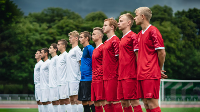 Two Professional Soccer Teams Posing for a Photo and Standing in Line. Professional Football Players Standing Before Important Match.