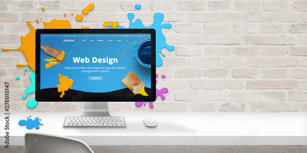 Fototapete Web design studio concept with modern web site teme and web design text on computer display surrounded by color drops. Free space beside on brick wall for text.