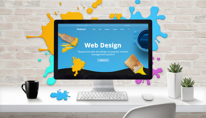 Web design concept. Modern web site on computer display surrounded by brush color drops. - obrazy, fototapety, plakaty