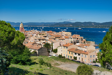 Panorama of Saint-Tropez, the roofs of houses, the chapel of St. Anne, the yacht in the bay. Commune in southeastern France in the region of Provence, Alpes - Cote d'Azur, France