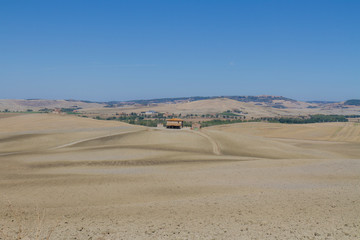 panorama of Tuscan countryside with blue sky Italy