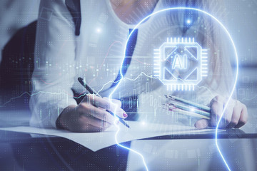 Multi exposure of woman's writing hand on background with brain hud. Concept of learning.