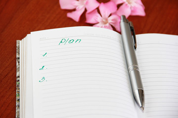 Naklejka premium Notebook for business and notes with white pages and pencil, penster