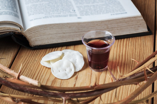 Holy Communion, a Cup of Wine and Bread with a Jesus Crown Thorn and Holy Bible