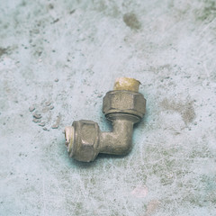 Old used fitting for plastic pipe connection