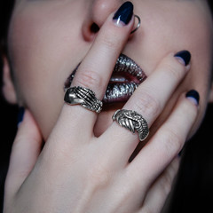 young woman with silver ring on hand