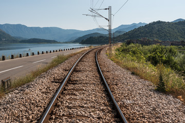 Fototapeta na wymiar Road and railroad through the Skadar Lake