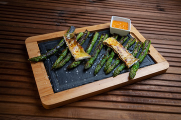 Fototapeta na wymiar asparagus recipe rosted whith brie cheese