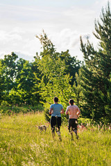 Couple with Dog  Exercising Together Outdoors