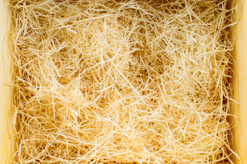 Natural wooden shredded wood shavings for gifting, shipping and stuffing. Top view.