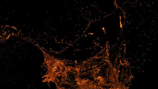Super Slow Motion Shot of Golden Splash at 1000fps Isolated on Black Background.