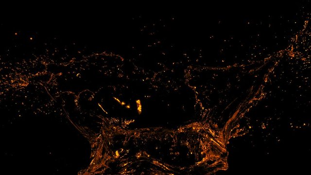 Super Slow Motion Shot of Golden Splash at 1000fps Isolated on Black Background.