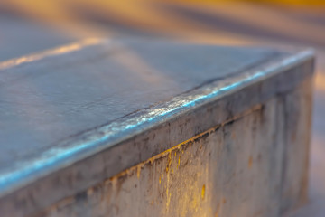 Close up view of a deck at a recreational skateboarding park on a sunny day