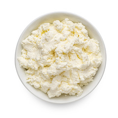 Cottage cheese or tvorog in a bowl isolated on white background. Top view. Rich in Calcium and...