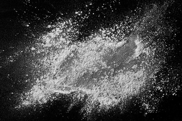 White powder isolated on black background, top view with clipping path