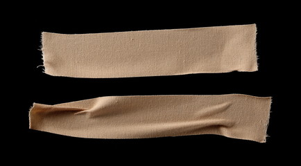 Adhesive bandage, first aid isolated on black background, top view with clipping path