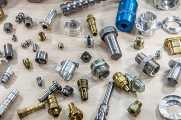 background of different metal products for metal working: cutters, connectors, nuts, fittings,...