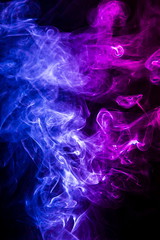 Colored smoke on black background