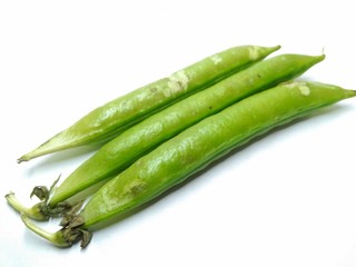 A picture of fresh green pea pods on a white background