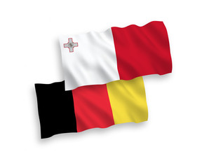 National vector fabric wave flags of Malta and Belgium isolated on white background. 1 to 2 proportion.