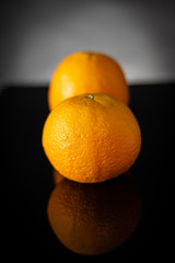 oranges on black back ground