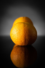 oranges on black background
