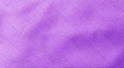Abstract closeup purple fabric texture background, blank shiny purple pattern background