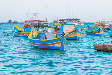 Marsaxlokk with Luzzu, traditional fishing boat from Malta islands
