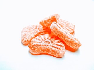 A picture of orange flavour candy isolated on white background