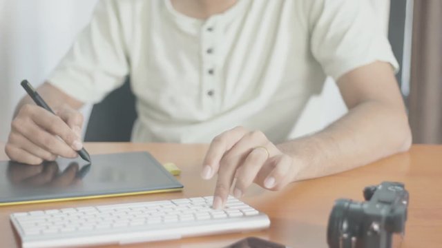 Graphic Artist Working on his Desk