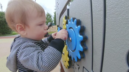 Child turns the gears