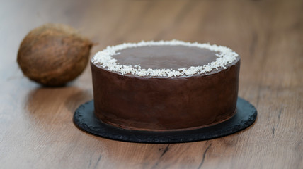 Delicious chocolate cake sprinkled with coconut on top.