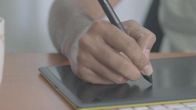 Designer / Artist Working With A Graphic Tablet