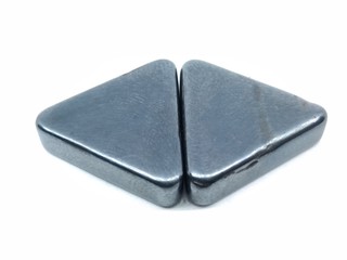 A picture of trangle magnets on white background